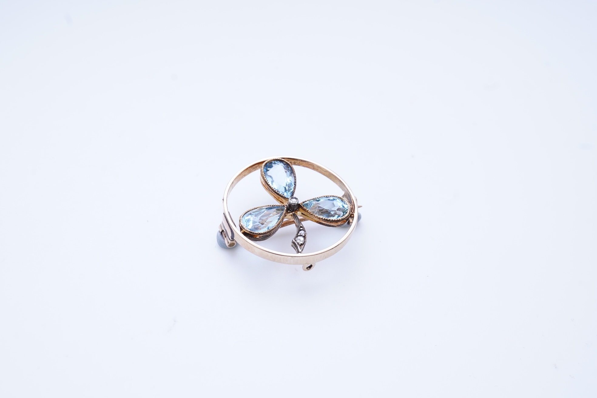 An aquamarine and diamond brooch, early 20th century